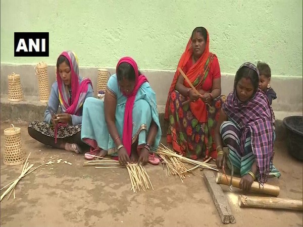 Jitan Devi along with other women making products from bamboo in her village in Ranchi. (Photo/ANI)