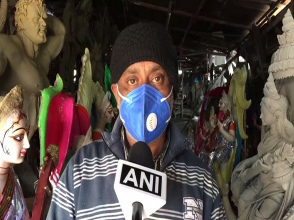 Sujit Paul an idol sculptor in his shop.  
