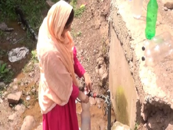 A local of Gool drawing water. (Photo/ANI)