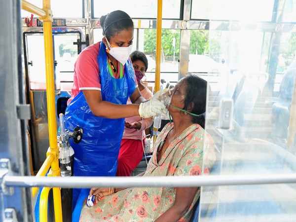 A COVID patient gets oxygen facility in a BMTC bus in Bengaluru. (Photo/ANI)