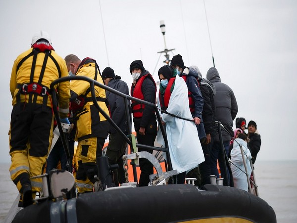 Migrants are brought ashore onboard a RNLI Lifeboat. (Photo Credit - Reuters)