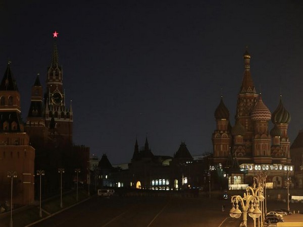 The Kremlin towers, the GUM department store and the St. Basil's Cathedral after the lights are switched off for Earth Hour in Moscow