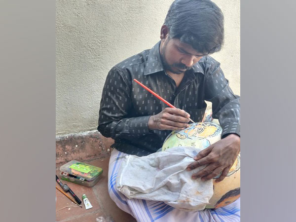 Chennai based artist Joel Fertician made COVID-19 related drawing on the clay pots [Photo/ANI]