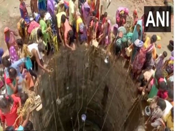 Villagers extracting water out of a well in Maharashtra's Khadial village.