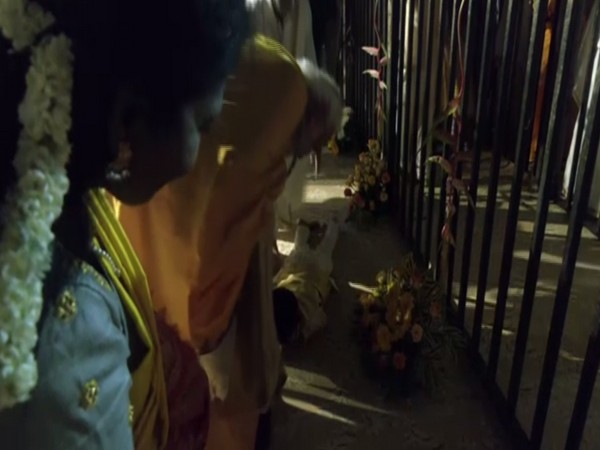 Child takes touches PM Modi's feet, seeks blessings (Photo:ANI)