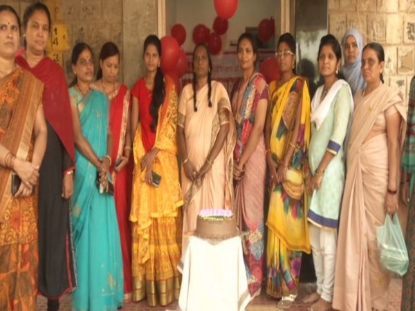 Employees standing outside the post office in Kalaburagi on Monday. Photo/ANI