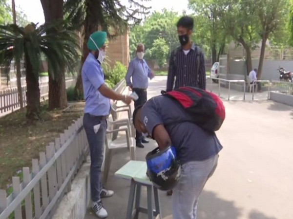 Thermal screening of students at entry point of SGGS College (Photo/ANI)