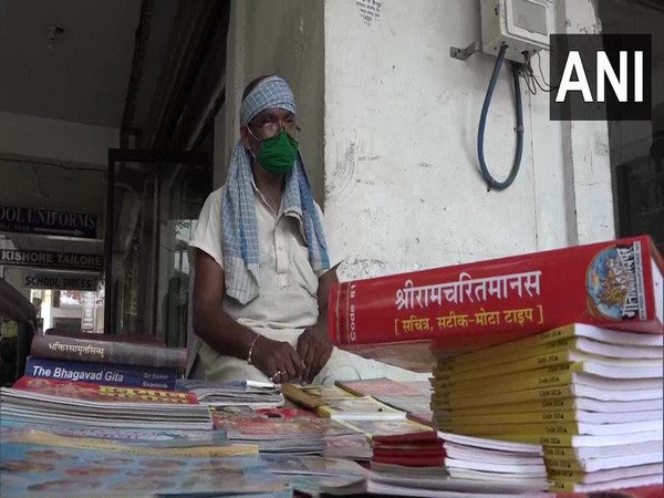 53-year-old Buddhi Sagar Pandey at his book stall in Agra. (Photo/ANI)