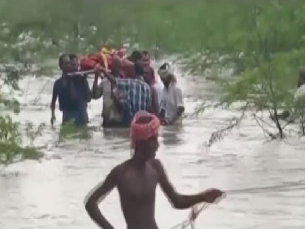 Villagers carrying dead body of a person (Photo/ANI)