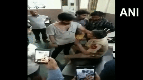 The viral video of cop being beaten in police station.