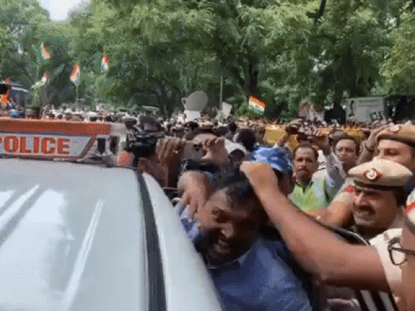 Delhi Police personnel were seen manhandling Congress Srinivas BV (Photo/ANI)