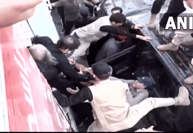 Former Pak PM Imran Khan waving to people during his long march  (Photo Credit: PTI)
