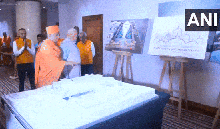 PM Modi inspects model of Swaminarayan Temple.  (Photo: ANI)