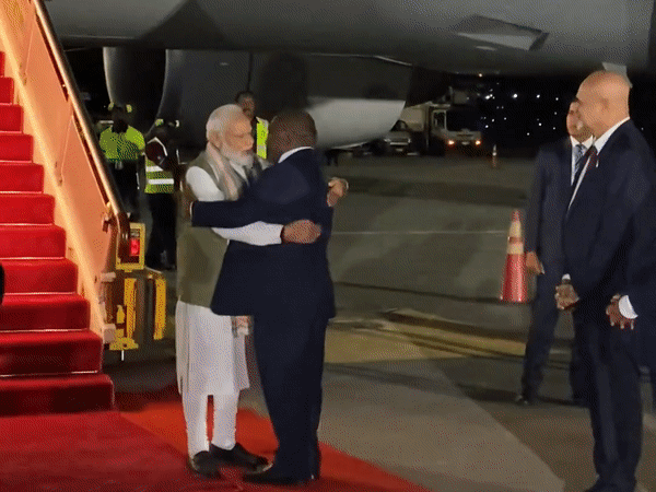 PNG Prime Minister James Marape seeking PM Modi's blessings by touching his feet at Port Moresby airport. (Photo/ANI)