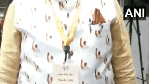 Minesh C Patel, wearing a unique Nehru jacket with an image of the PM Modi printed on it.