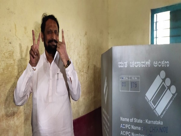 Karnataka Deputy Chief Minister Laxman Savadi at a polling booth in Athani constituency [Photo/ANI]