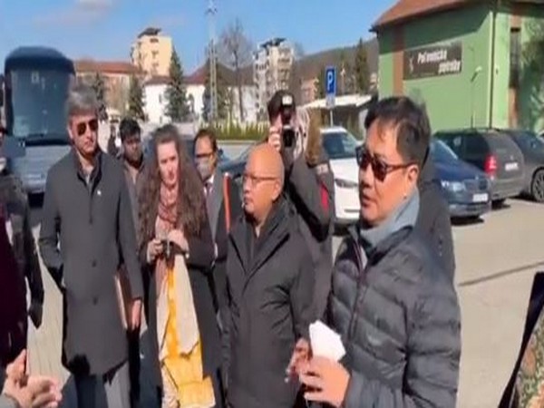 Union minister Kiren Rijiju interacts with a group of Indian students evacuated from Ukraine before their departure to India from Kosice, Slovakia. 