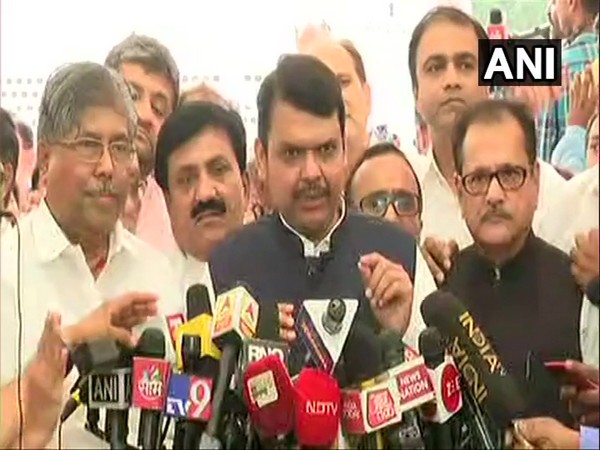 Former Maharashtra Chief Minister Devendra Fadnavis talking to media outside the Legislative Assembly in Mumbai on Sunday.