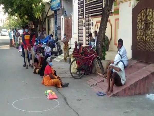 People at a fair price shop in Mangalagiri in Andhra Pradesh. Photo/ANI