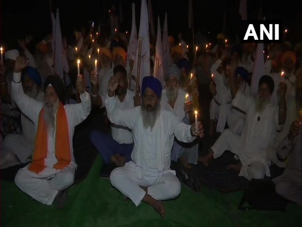 Members of KSMC holding candlelight vigil in Amritsar. (Photo/ANI)