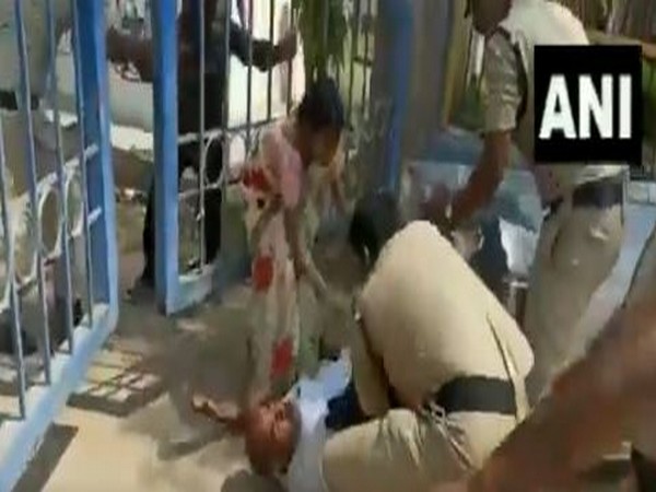 Father of a girl who committed suicide kicked by police personnel in Sanga Reddy district. Photo/ANI