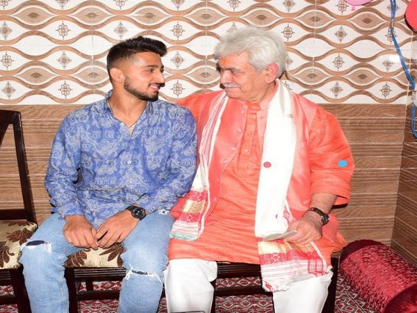 Jammu and Kashmir Lieutenant Governor Manoj Sinha with cricketer Umran Malik. (ANI/photo)