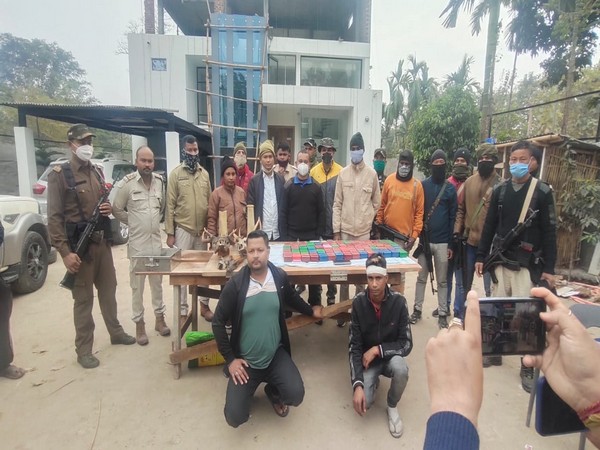 Assam police with druglord Baba Hazarika and his truck driver. (Photo/ANI)