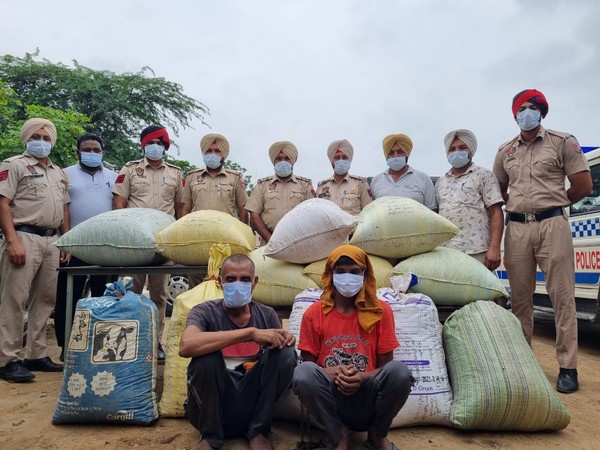 Kapurthala police with two smugglers involved in the racket. (Photos/ANI)