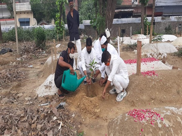 Hanif (second from left) planting a sapling at a Lucknow graveyard (ANI).