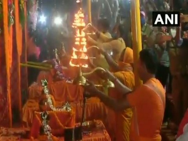 Priests performing 'Aarti' at the ghat of Saryu river on Monday. (Photo/ANI)