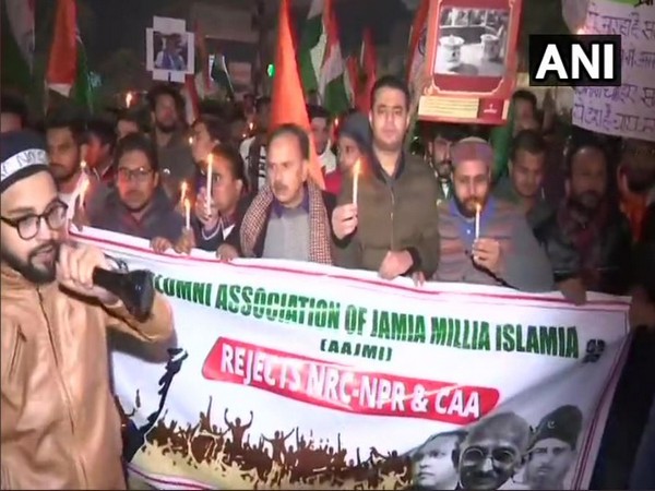 Alumni Association of Jamia Millia Islamia during the candlelight march on Wednesday at Jamia Nagar in New Delhi.