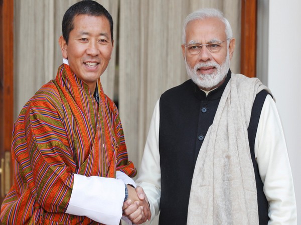Bhutan's Prime Minister Lotay Tshering and Prime Minister Narendra Modi shake hands ahead of their meeting at Hyderabad House in New Delhi, India, December 28, 2018 (Photo Credit: Reuters) 