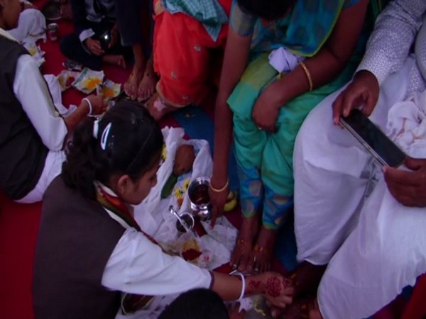 A student performing 'padapuja' in the school during New Year celebration on Wednesday in Karnataka's Shivamogga. Photo/ANI