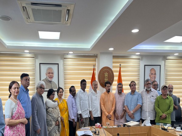 Union Sports Minister Anurag Thakur with the 10-member jury which called on him (Image: ANI)