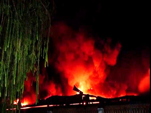 Flames rising out of the warehouse in Greater Noida on Monday. Photo/ANI