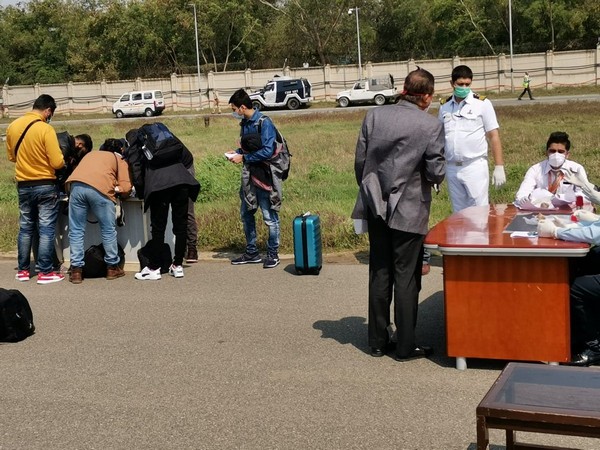 Air India crew complete all formalities for screening passengers from Milan at an isolation bay at Delhi Airport