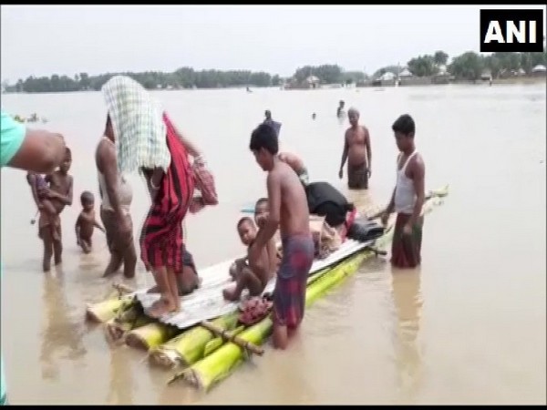 Visuals of villagers shifting to safe places due to flood in Bihar on Tuesday. Photo/ANI