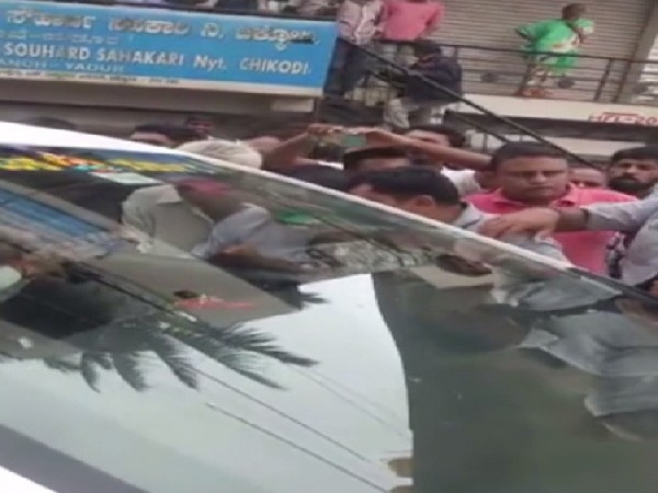 Flood-affected people stopping Karnataka Minister KS Eshwarappa’s car in Belgaum on Saturday.