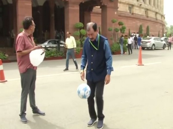 Trinamool Congress MP Prasun Banerjee playing football in Parliament on Thursday. Photo/ANI