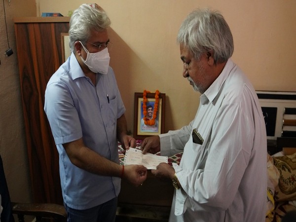Delhi Revenue Minister Kailash Gahlot on Sunday handed over Rs 1 crore cheque to the family of 