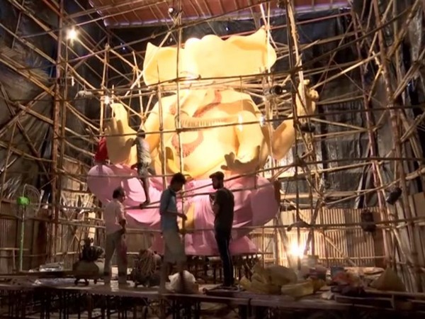 Labourers working in constructing the 22 ft long idol of Lord Ganpati in Mumbai