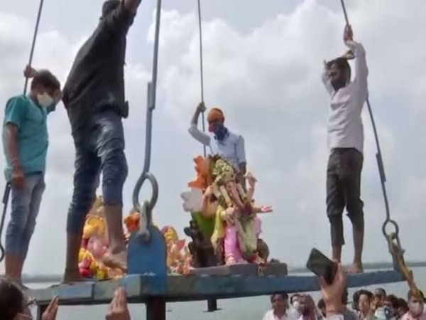 A number of cranes were also kept at the site where devotees placed their deities for the immersion. (Photo: ANI)