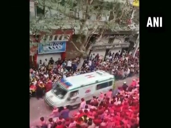 Devotees made way for an ambulance during Ganesh idol immersion
