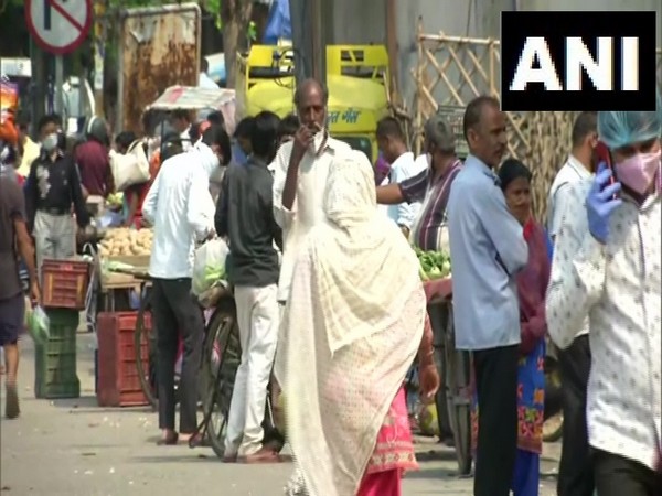 People violate social distancing norms, other guidelines while buying essentials in Noida. Photo/ ANI