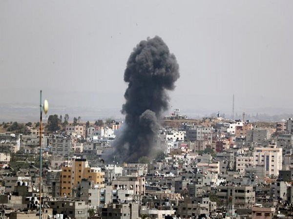 Smoke rises from a building in Gaza after Israeli airstrikes.
