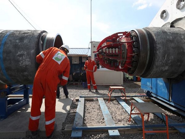 Workers are seen at the construction site of the Nord Stream 2 gas pipeline, near the town of Kingisepp, Leningrad region, Russia (Photo Credit: Reuters)