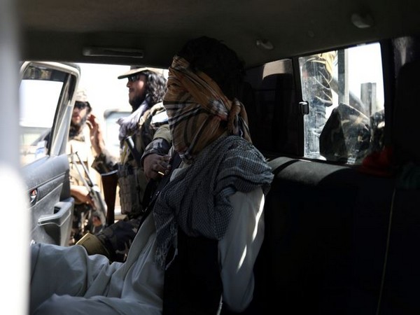 A suspected ISIS member sits blindfolded in a Taliban Special Forces' car in Kabul, Afghanistan (Photo Credit: Reuters)