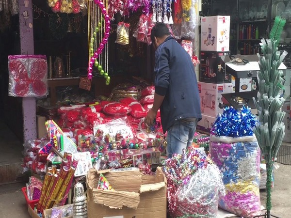 A shopkeeper decking his shop with Christmas products on Wednesday in West Bengal's Siliguri. Photo/ANI