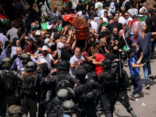 Violence at Al Jazeera reporter's funeral in Jerusalem (Photo Credit: Reuters)