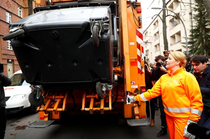 Germany's Family and Women's Minister Franziska Giffey, carrying out the duties of a sanitation worker, in Berlin on March 7